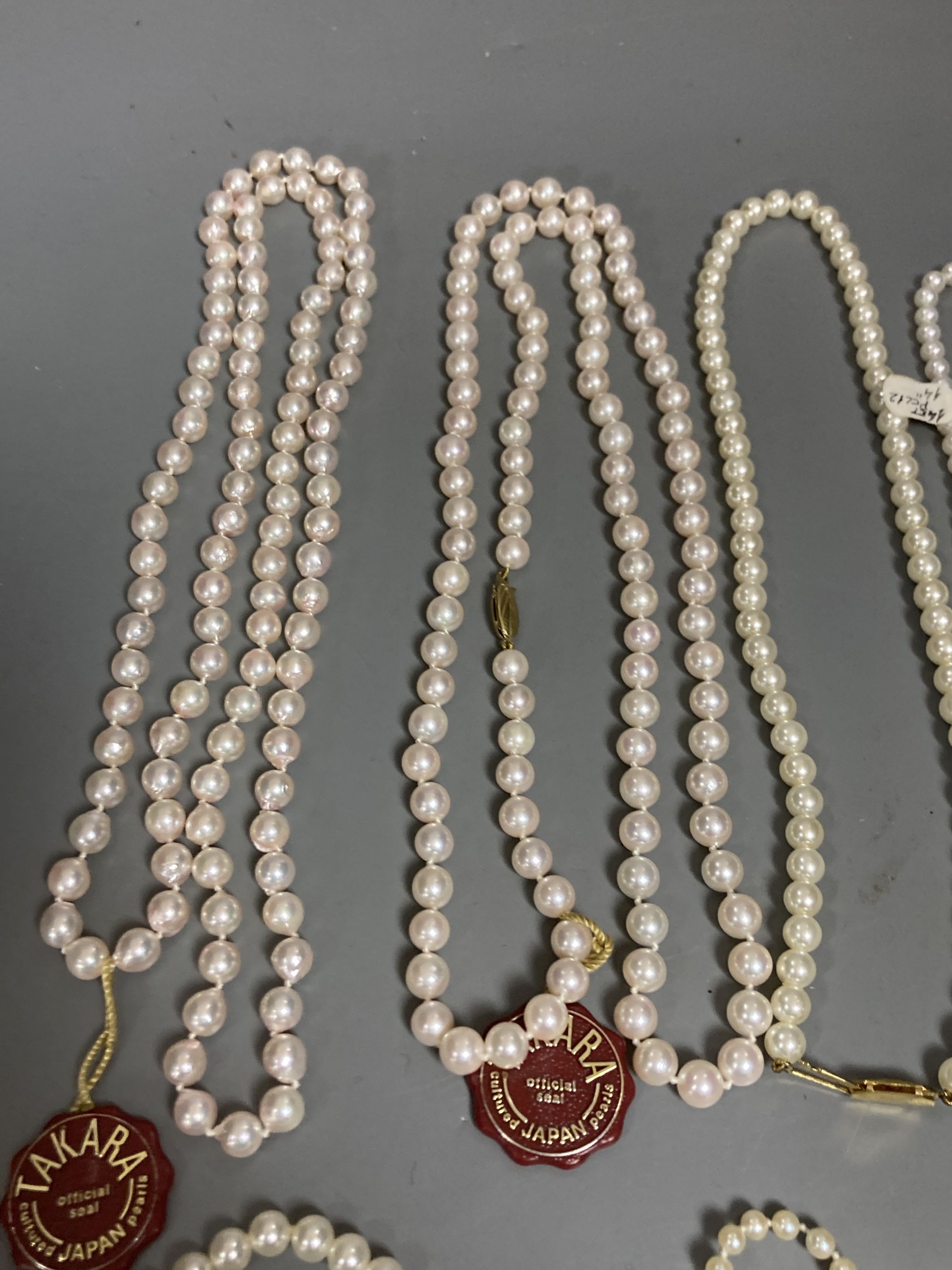 Four assorted modern single strand cultured pearl necklaces, longest 83cm, one other 9ct and cultured pearl necklace(a.f.) and two simulated pearl necklaces.